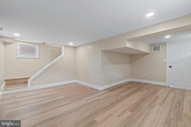 2701 Christopher Ave, Baltimore, MD 21214 - finished below grade area with light wood-type flooring, recessed lighting, and stairs