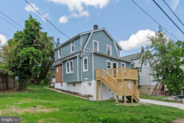2701 Christopher Ave, Baltimore, MD 21214 - rear view of property with stairs, a wooden deck, and a chimney