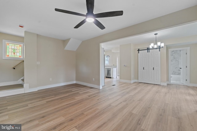 2701 Christopher Ave, Baltimore, MD 21214 - unfurnished living room with a barn door, a ceiling fan, a chandelier, and light wood-type flooring