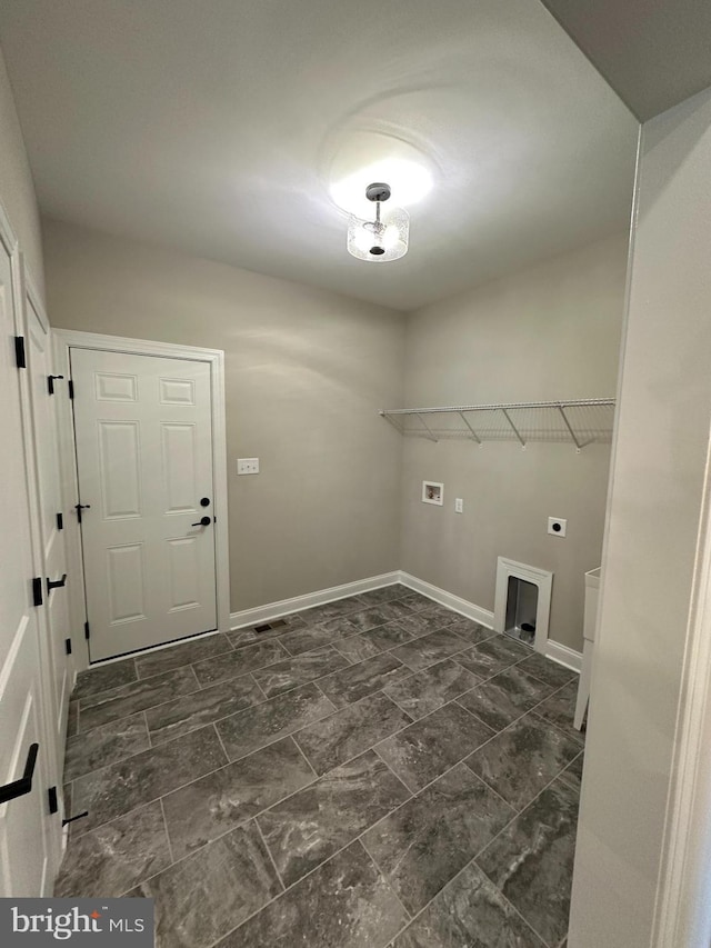 laundry area with marble finish floor, hookup for an electric dryer, laundry area, and washer hookup