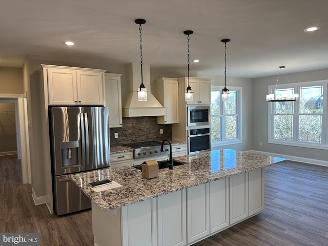 kitchen featuring tasteful backsplash, dark wood-type flooring, white cabinets, baseboards, and appliances with stainless steel finishes