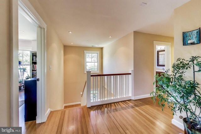 3906 Halsey St, Kensington, MD 20895 - corridor featuring wood finished floors, baseboards, and an upstairs landing
