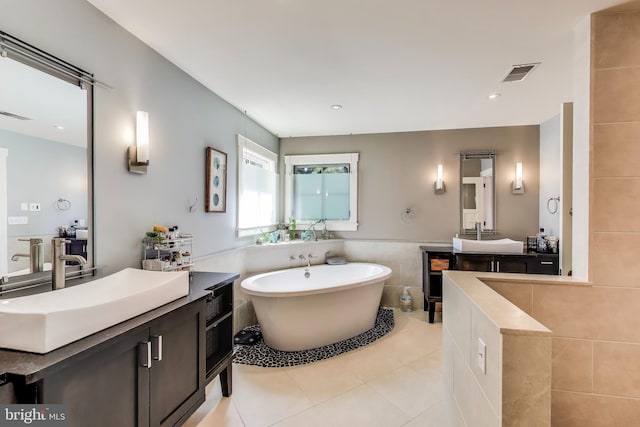 3906 Halsey St, Kensington, MD 20895 - bathroom featuring tile patterned flooring, a freestanding tub, tile walls, and vanity