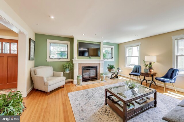 3906 Halsey St, Kensington, MD 20895 - living room featuring light wood finished floors, a fireplace with flush hearth, baseboards, and recessed lighting