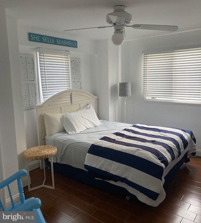 bedroom with wood finished floors and a ceiling fan