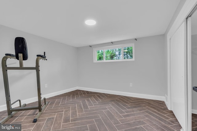 workout room with baseboards
