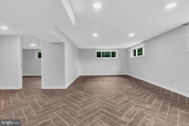 below grade area with baseboards and recessed lighting