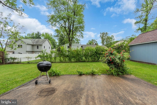 view of patio / terrace featuring a residential view, fence, and grilling area