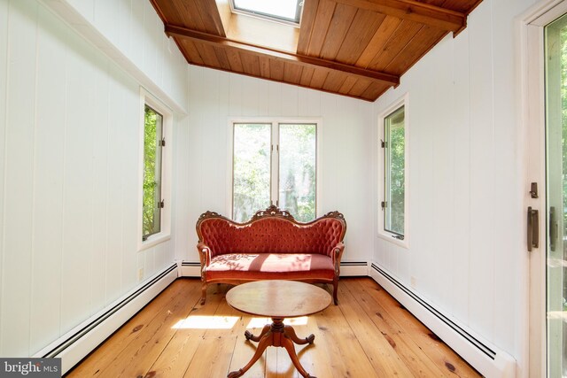 2957 River Rd, New Hope, PA 18938 - sunroom / solarium featuring lofted ceiling with skylight, a baseboard radiator, hardwood / wood-style floors, and wood ceiling