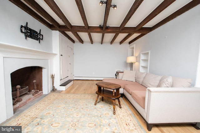 2957 River Rd, New Hope, PA 18938 - living area with light wood-type flooring, a baseboard radiator, and beamed ceiling