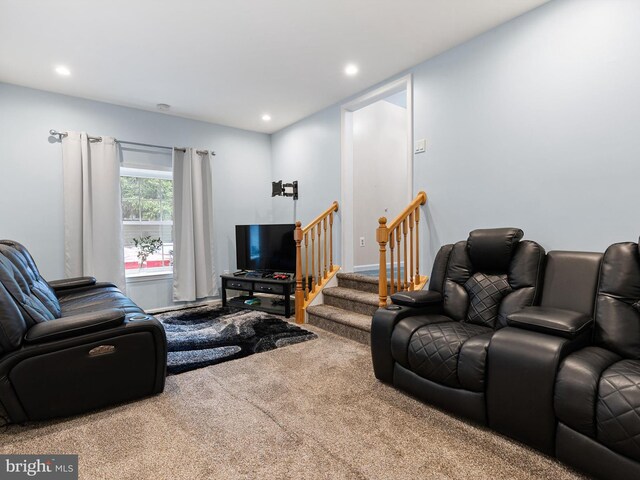 living room with stairs, recessed lighting, and carpet floors