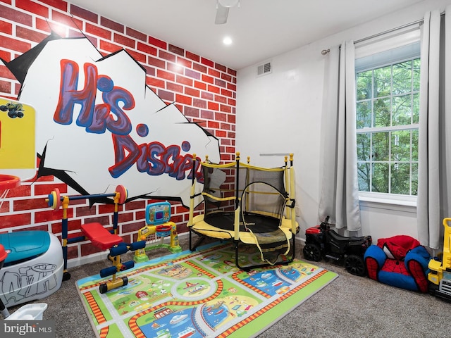 recreation room featuring recessed lighting, visible vents, a healthy amount of sunlight, and carpet floors