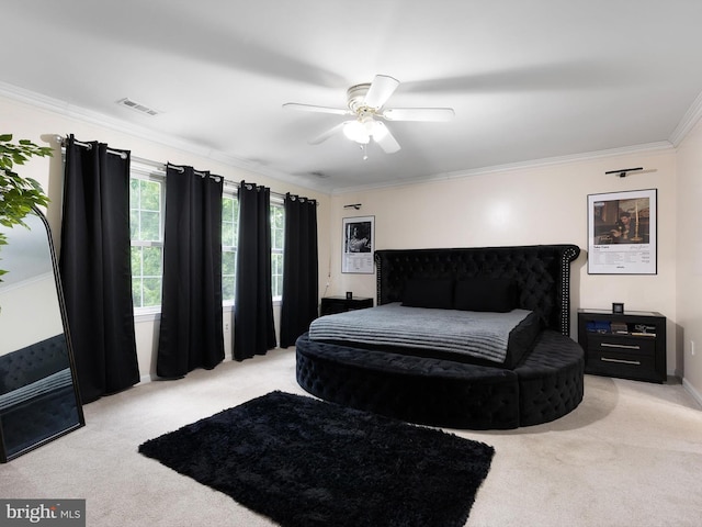 carpeted bedroom featuring a ceiling fan, ornamental molding, and visible vents