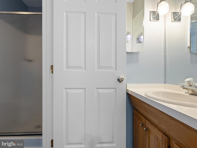 bathroom featuring vanity and a stall shower