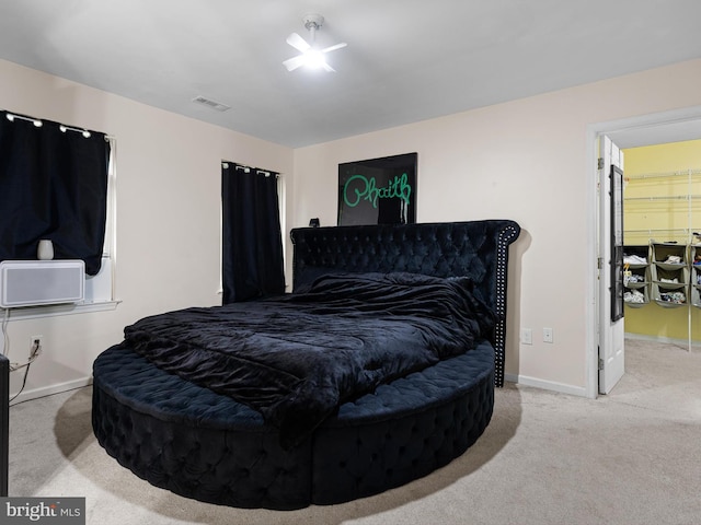 bedroom featuring baseboards, carpet flooring, and visible vents