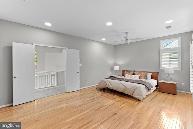 bedroom with wood finished floors, recessed lighting, baseboards, and ceiling fan