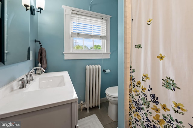 full bathroom featuring toilet, baseboards, radiator heating unit, a shower with shower curtain, and vanity