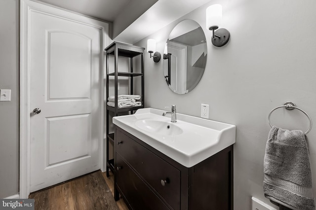bathroom with vanity and wood finished floors