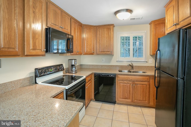 6018 Good Lion Ct, Alexandria, VA 22315 - kitchen featuring black appliances, a sink, and brown cabinetry