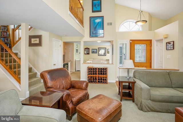 6018 Good Lion Ct, Alexandria, VA 22315 - living area with carpet flooring, a high ceiling, stairway, and baseboards