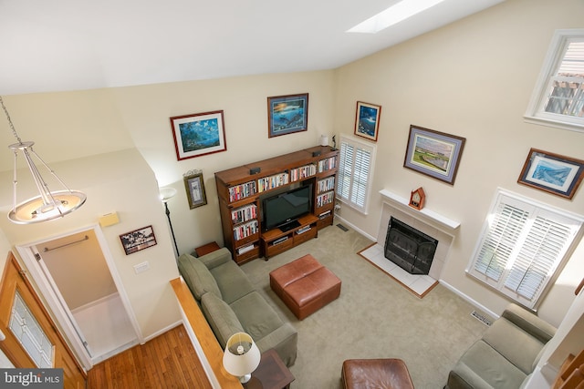 6018 Good Lion Ct, Alexandria, VA 22315 - living area with healthy amount of natural light, baseboards, and high vaulted ceiling