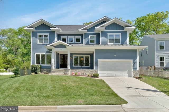 view of front of house featuring board and batten siding, concrete driveway, a standing seam roof, a garage, and metal roof