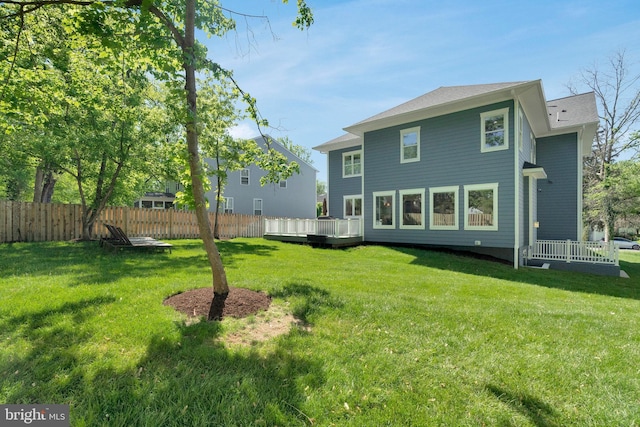 rear view of property with a deck