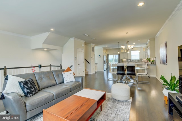 living room with recessed lighting, dark wood-style flooring, a chandelier, ornamental molding, and stairs
