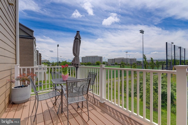 wooden deck featuring outdoor dining space