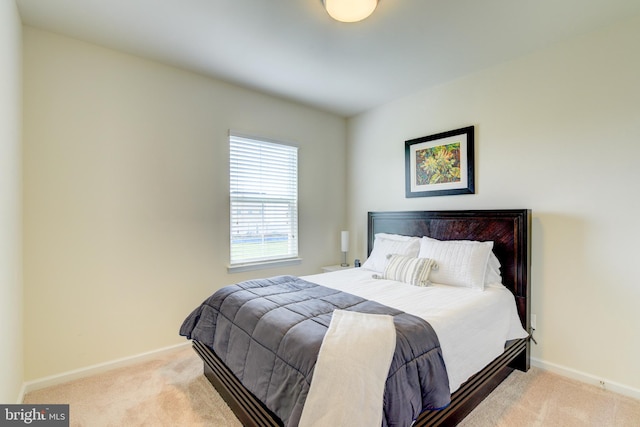 bedroom featuring carpet floors and baseboards