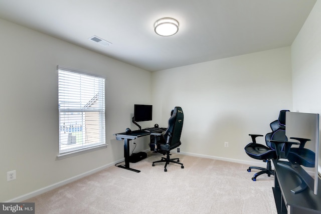 carpeted office space featuring baseboards