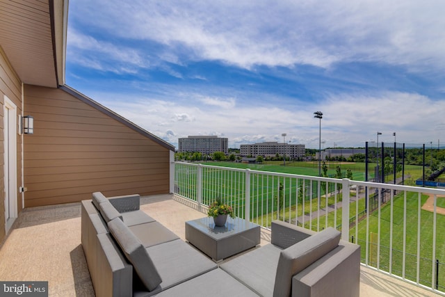 view of patio featuring a balcony and outdoor lounge area