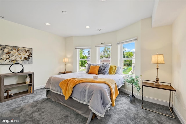 carpeted bedroom with multiple windows, baseboards, and recessed lighting