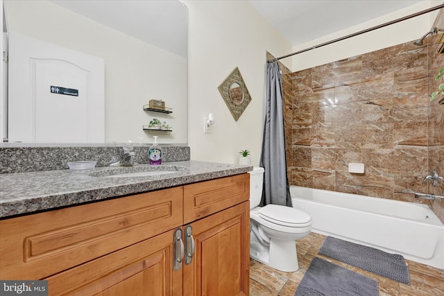 full bathroom with toilet, vanity, and shower / bath combo with shower curtain