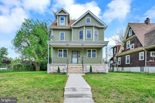 view of front of house with covered porch and a front lawn