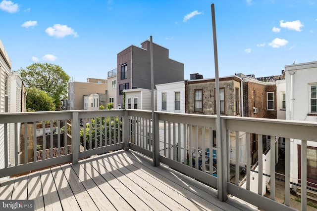 wooden deck featuring a residential view