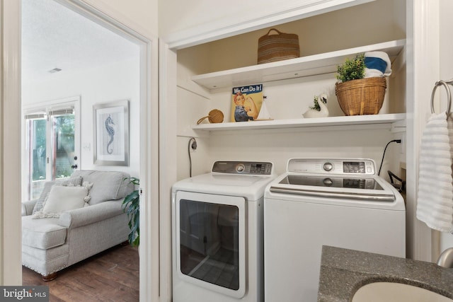 1215 Pine Ave, Shady Side, MD 20764 - clothes washing area with washer and dryer and wood finished floors