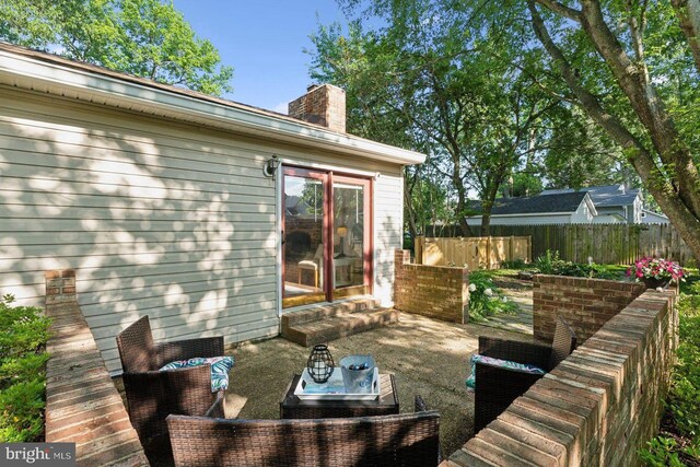 1215 Pine Ave, Shady Side, MD 20764 - wooden deck with fence, outdoor lounge area, a patio, and entry steps
