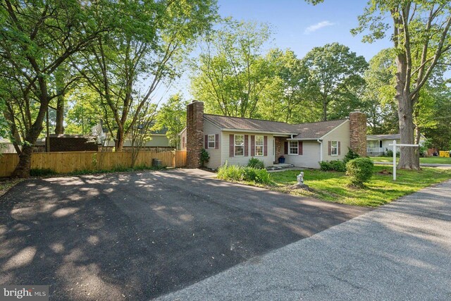 1215 Pine Ave, Shady Side, MD 20764 - view of front of property with a chimney and fence