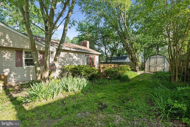 1215 Pine Ave, Shady Side, MD 20764 - view of yard with a storage unit and an outbuilding