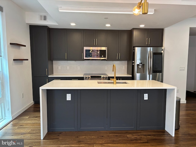 1501 N 31st St Unit 305, Philadelphia, PA 19121 - kitchen with appliances with stainless steel finishes, a sink, light countertops, tasteful backsplash, and recessed lighting