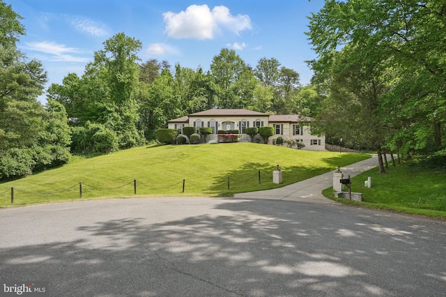 view of property's community with a lawn