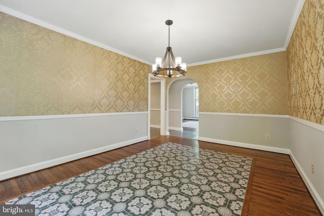 unfurnished dining area featuring arched walkways, a notable chandelier, hardwood / wood-style floors, and wallpapered walls