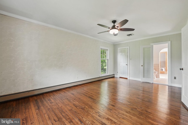 unfurnished room with crown molding, visible vents, a ceiling fan, and hardwood / wood-style flooring
