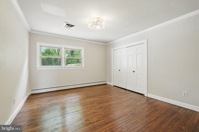 unfurnished bedroom featuring crown molding, visible vents, baseboards, baseboard heating, and hardwood / wood-style flooring