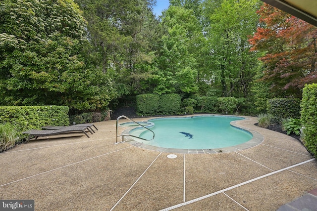 outdoor pool with a patio