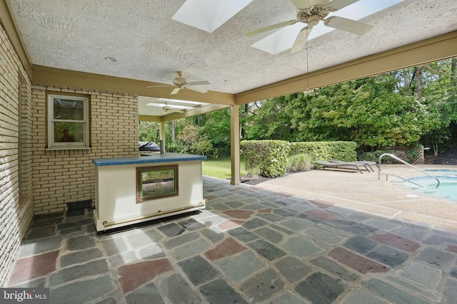 view of patio / terrace featuring visible vents, a fenced in pool, and ceiling fan
