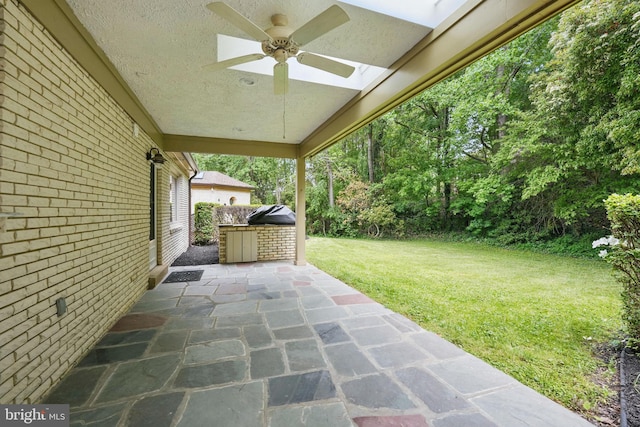 view of patio featuring a ceiling fan