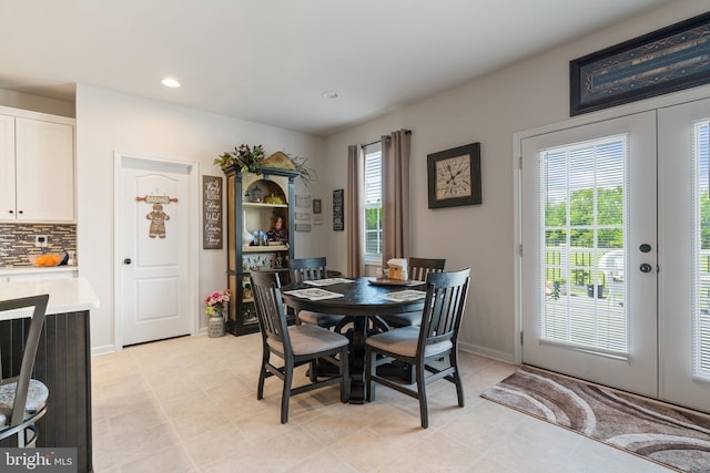 dining area with french doors, recessed lighting, and baseboards