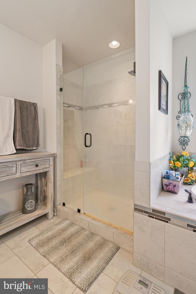 full bathroom featuring tile patterned flooring, a stall shower, and recessed lighting